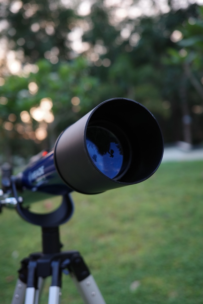 Front view of the optical tube showcasing the refracting lens and the glare along with its dew shield
