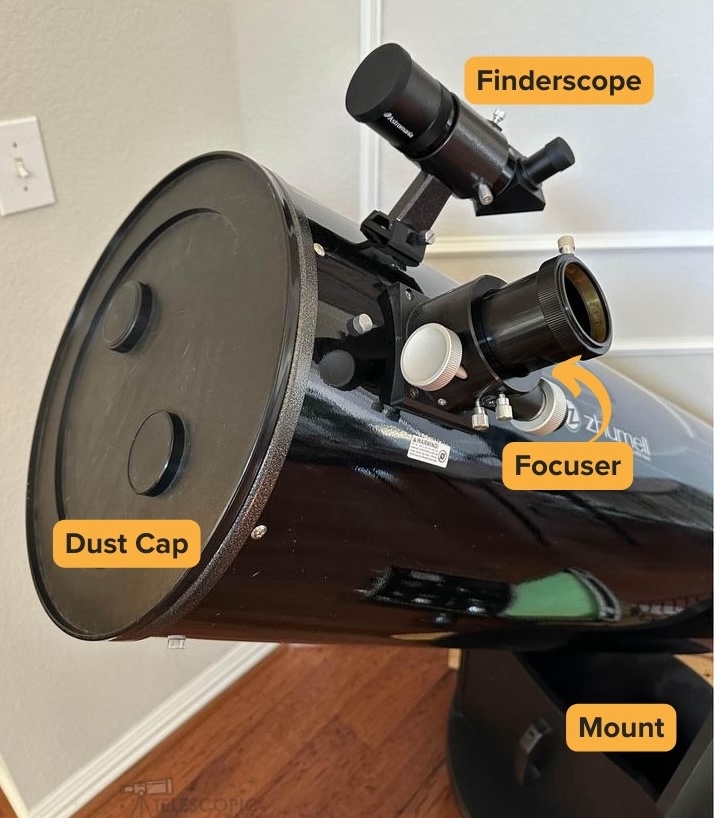 Covered optical tube of Zhumell Z12 along with the focuser and finderscope, sitting on its mount.