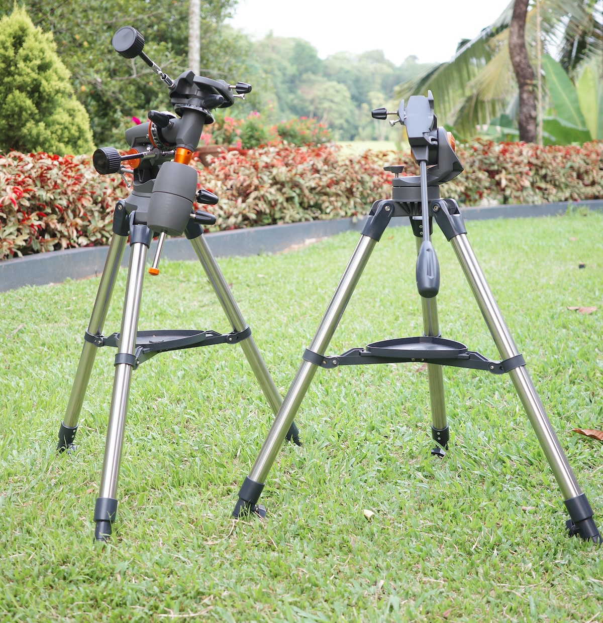 the left equipped with an equatorial mount head and counterweight, the right with a simple alt‑azimuth pan‑handle mount